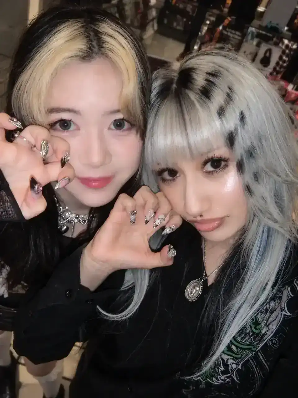 Two models showing their Bae Nail looks together.
